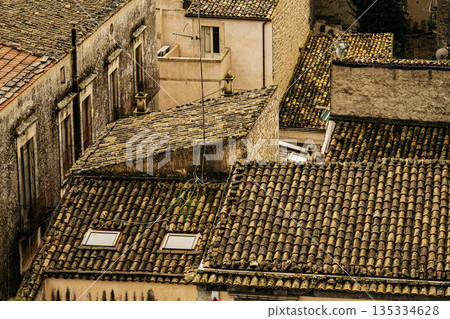 Panoramic View Over Ragusa From Cathedral Of San Giovanni Battista: Historic Sicilian City Rooftops, Church Domes, And Dense Stone Architecture Under Overcast Sky 135334628