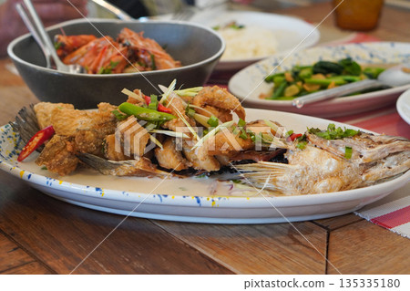 fish slice with coconut milk curry and chilli in a ceramic dish on the table, food, hot, object, delicious fish slice with coconut milk curry and chilli in a ceramic dish on the table, food, hot, object, delicious 135335180