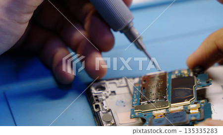 Soldering electronic components on phone Soldering electronic components on phone 135335283