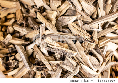 Teak wood pieces are used in rituals in Asia to cleanse the space of evil spirits. 135335396