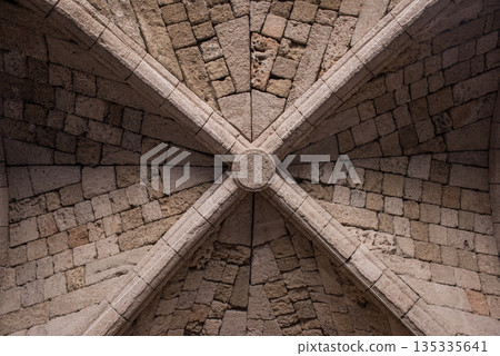 Antique ceiling with rose window and cross beams 135335641
