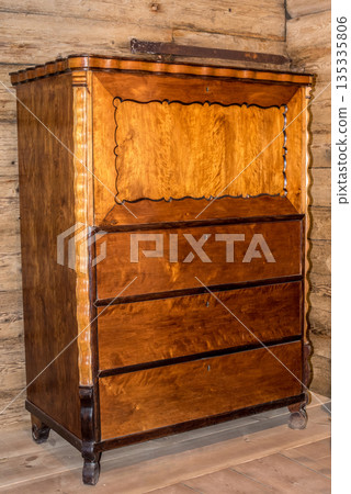 The tall chest of drawers in the background of an old house The tall chest of drawers in the background of an old house 135335806