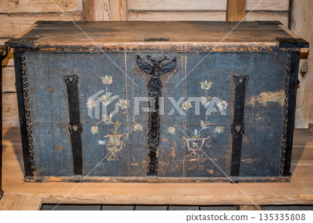 Old wooden chest against wooden wall Old wooden chest against wooden wall 135335808