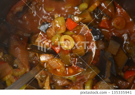 Vegetable caponata with olives 135335941