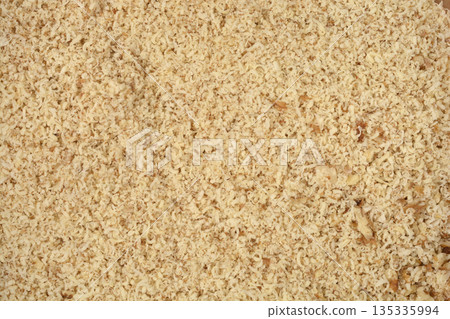 Grated walnuts background texture 135335994