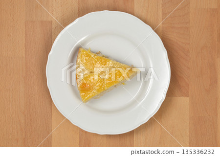 Orange Upside Down Cake Slice on White Plate Orange Upside Down Cake Slice on White Plate 135336232