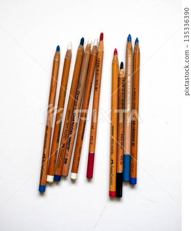 Multicolored pencils isolated on white background, top view. Wooden colorful pencils on a white table. Back to school. Multicolored pencils isolated on white background, top view. Wooden colorful pencils on a white table. Back to school. 135336390