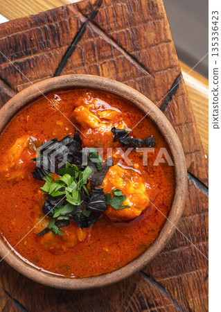 Georgian shrimp chakhokhbili in tomato sauce 135336423