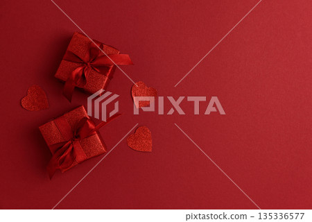 Red Glitter Gift Boxes and Hearts on Festive Background for Valentine's Day Celebration Red Glitter Gift Boxes and Hearts on Festive Background for Valentine's Day Celebration 135336577