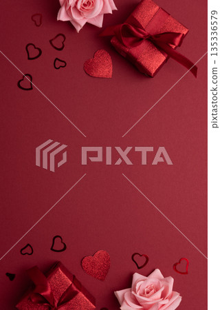 Festive Red Gift Boxes with Roses and Heart Confetti onFestive Background for Valentine's Day Celebration 135336579