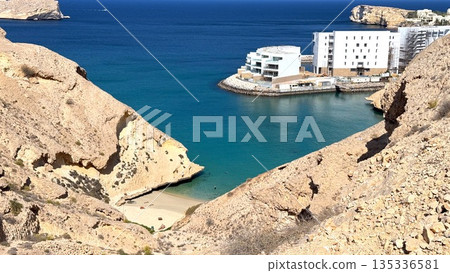 Hidden Coastal Paradise, Unexplored Bay With Vibrant Waters, Beautiful Cove Surrounded By Towering Cliffs And Clear Waters, Secluded Ocean Retreat With Striking Geological Features And Azure Seas 135336581