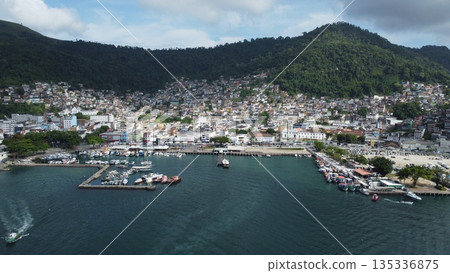 Coastal city of Angra dos Reis surrounded by mountains and ocean, Brazil 135336875