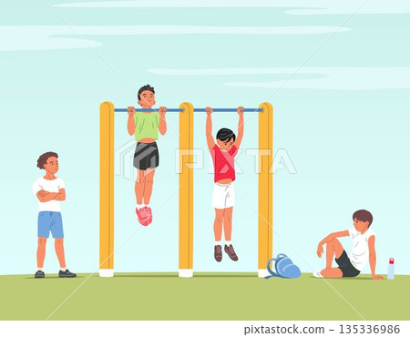 School boys doing pull ups on playground bars 135336986