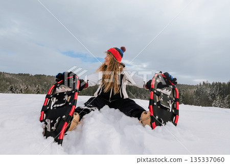 Person Snowshoeing in Snowy Outdoor Landscape Person Snowshoeing in Snowy Outdoor Landscape 135337060