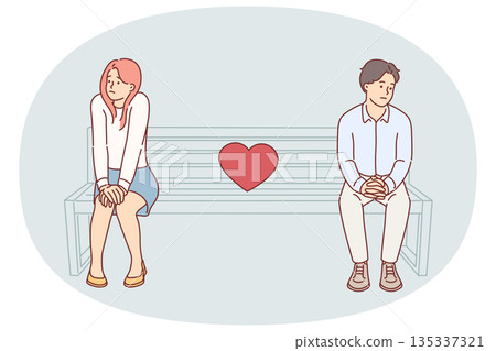 Shy couple on first date, sitting on park bench and feeling awkward due to lack of common interests 135337321