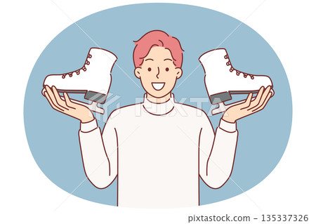 Man holds pair of ice skates in hands, inviting you to sign up for figure skating or hockey courses 135337326