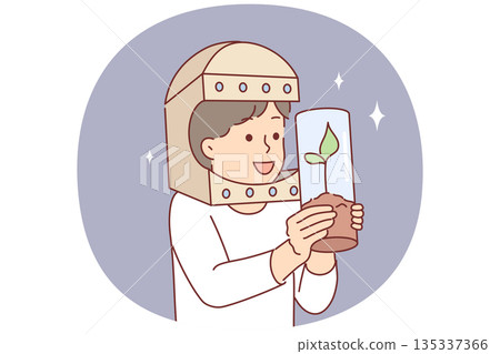 Astronaut boy holds tree in test tube and dreams of growing plants flying into space Astronaut boy holds tree in test tube and dreams of growing plants flying into space 135337366