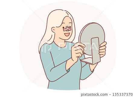 Happy woman after rhinoplasty surgery on nose looks in mirror and rejoices at improvement own image Happy woman after rhinoplasty surgery on nose looks in mirror and rejoices at improvement own image 135337370