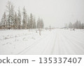 Snow Covered Rural Road During Winter Snowfall in Idaho Snow Covered Rural Road During Winter Snowfall in Idaho 135337407