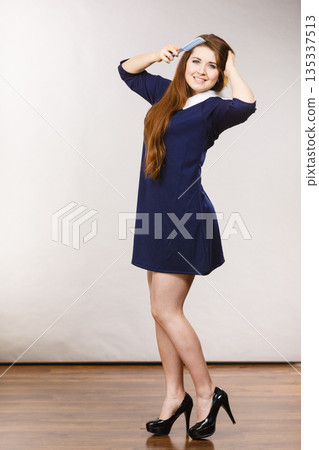 Happy positive woman with long brown hair Happy positive woman with long brown hair 135337513