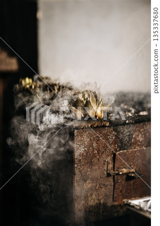 Fresh Artichokes Barbecue At Catania Market In Sicily: Trimming And Steaming Green Vegetables On Hot Surface In Traditional Street Food Scene 135337680