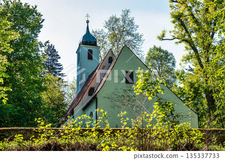 Church St.Clemens in Kranzberg near Freising, Bavaria with ancient graveyard and beautiful old wrought iron crosses Church St.Clemens in Kranzberg near Freising, Bavaria with ancient graveyard and beautiful old wrought iron crosses 135337733
