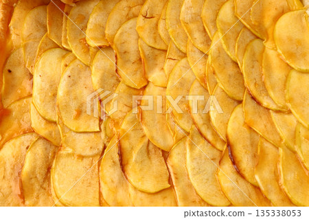 Delicious homemade apple pie with flaky crust and warm cinnamon-spiced filling. 135338053