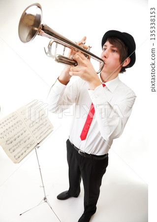 Portrait of a young man playing his Trumpet Portrait of a young man playing his Trumpet 135338153