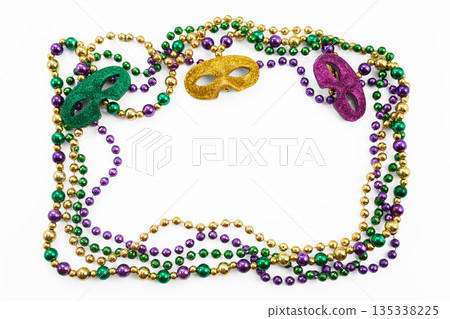 Mardi gras beads and masks forming frame 135338225