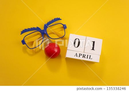 Celebrating april fool's day with funny glasses and clown nose 135338246