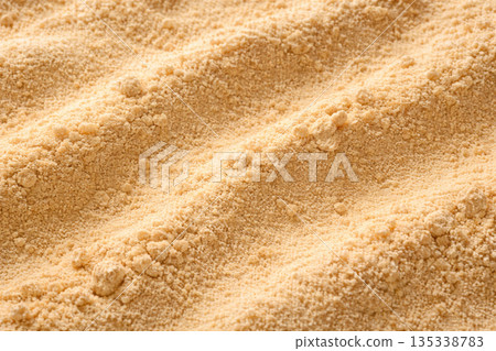 Macro texture background of soybean flour fine powder and grains Macro texture background of soybean flour fine powder and grains 135338783