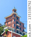 Borusan Contemporary's historic brick building showcases unique architectural details under clear blue skies. 135338792