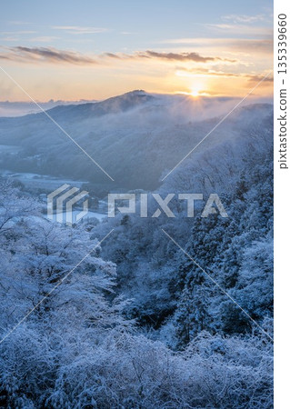Morning on a snowy mountain covered in frost Morning on a snowy mountain covered in frost 135339660