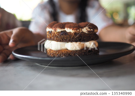 Dessert on a plate at a cafe in the afternoon Dessert on a plate at a cafe in the afternoon 135340990