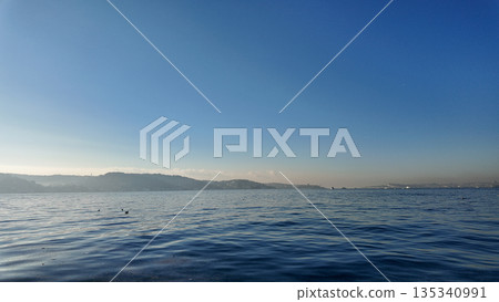 View of water and hills at dawn near the coast in istanbul  135340991
