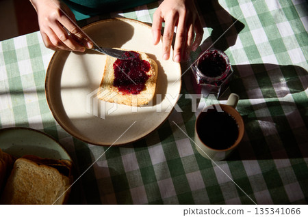 Toast With Jam For Breakfast On Checkered Tablecloth During Peanut Butter And Jelly Day Toast With Jam For Breakfast On Checkered Tablecloth During Peanut Butter And Jelly Day 135341066