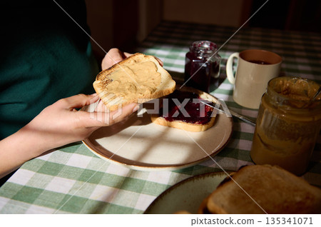 Cozy Breakfast Moment: Peanut Butter And Jelly On Toast At A Sunlit Table Cozy Breakfast Moment: Peanut Butter And Jelly On Toast At A Sunlit Table 135341071