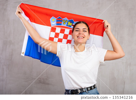 Positive woman supporting Croatia on world championship Positive woman supporting Croatia on world championship 135341216