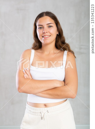 Young woman in casual clothes posing in studio Young woman in casual clothes posing in studio 135341223