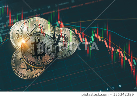 A shiny gold Bitcoin coin stacked on other coins, set against a dark background with red and green candlestick charts illustrating a volatile cryptocurrency market downtrend. A shiny gold Bitcoin coin stacked on other coins, set against a dark background with red and green candlestick charts illustrating a volatile cryptocurrency market downtrend. 135342389