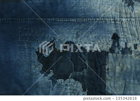 Well-worn, faded indigo-dyed rag fabric Well-worn, faded indigo-dyed rag fabric 135342618