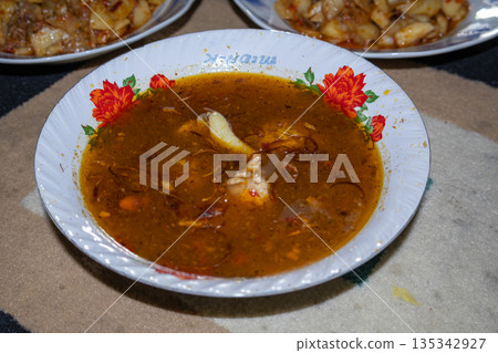 Authentic Lombok Cuisine: Begawe Dish Featuring Rich Spices and Coconut Milk, A Traditional Culinary Delight for Cultural Celebrations Authentic Lombok Cuisine: Begawe Dish Featuring Rich Spices and Coconut Milk, A Traditional Culinary Delight for Cultural Celebrations 135342927