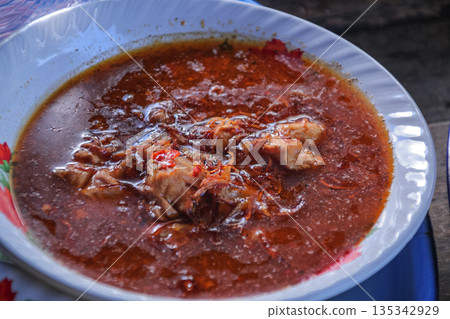 Authentic Lombok 'Begawe' Dish: Spicy Meat Simmered in Coconut Milk and Traditional Spices, Showcasing Indonesian Culture and Culinary Heritage Authentic Lombok 'Begawe' Dish: Spicy Meat Simmered in Coconut Milk and Traditional Spices, Showcasing Indonesian Culture and Culinary Heritage 135342929