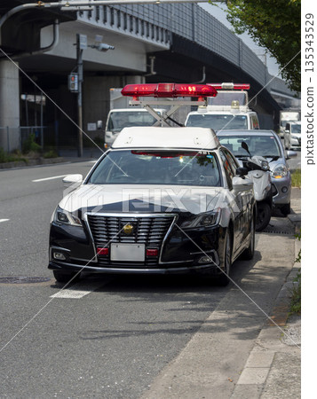 Police vehicle handling an accident Police vehicle handling an accident 135343529