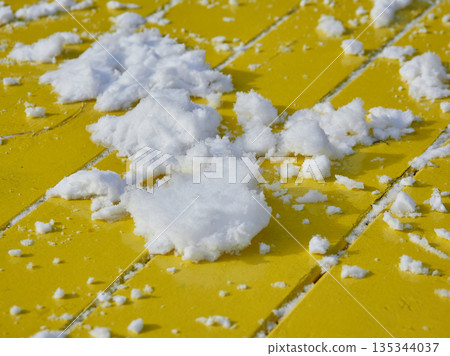 Snow on a table in a winter park 135344037
