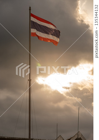 A Thailand national flag at sunset. 135344132