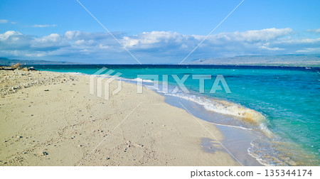 Beautiful view of white sand beach and blue sky Beautiful view of white sand beach and blue sky 135344174
