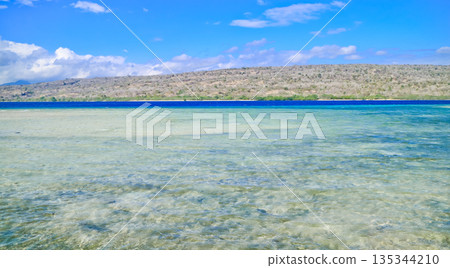 Beautiful view of white sand beach and blue sky 135344210