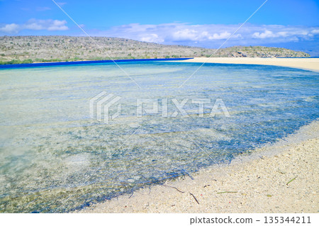 Beautiful view of white sand beach and blue sky Beautiful view of white sand beach and blue sky 135344211