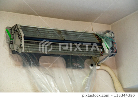 Air conditioner disassembled for cleaning Air conditioner disassembled for cleaning 135344380